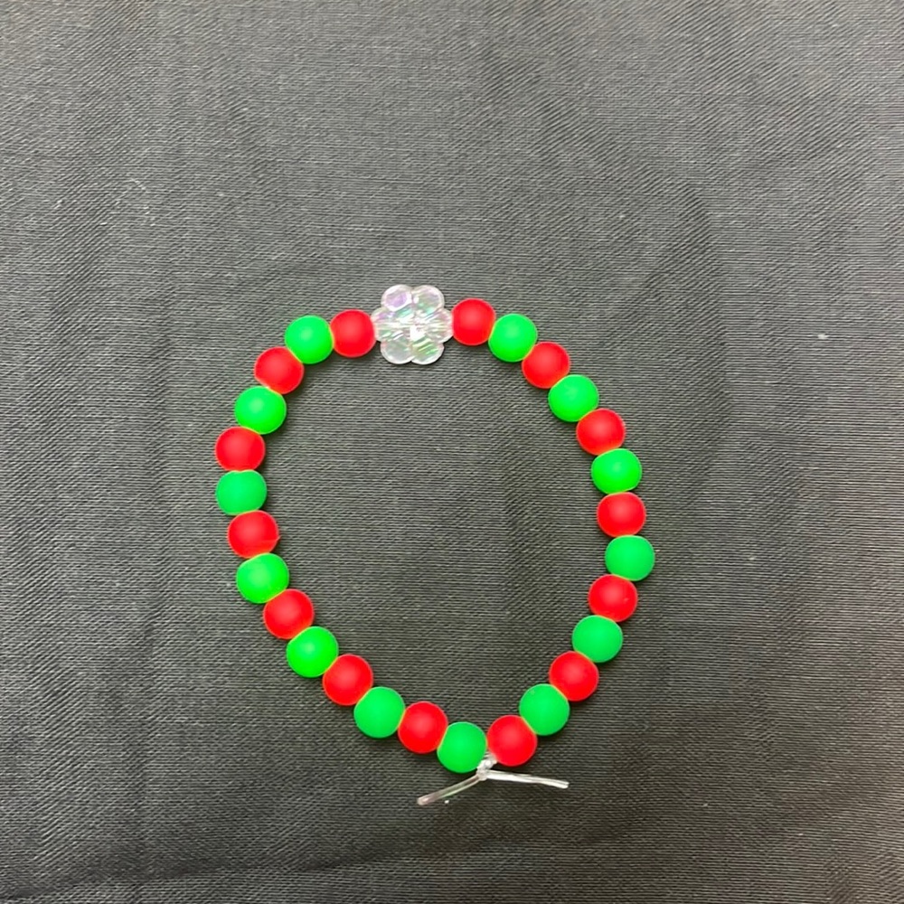 Red and green Christmas bracelet with a flower